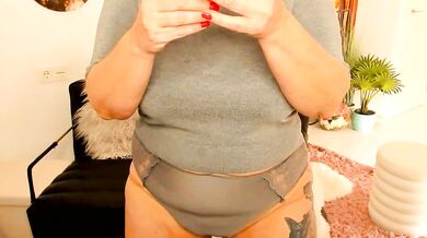 Watch Milf-Ella's strapon play with her big tits and deepthroat skills in a wild anal strip show