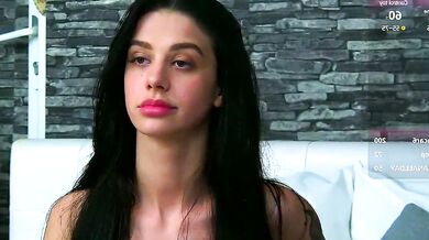 ArinaRhodes, the black-haired cam girl, strips, teases, and finger-bangs herself in hot striptease