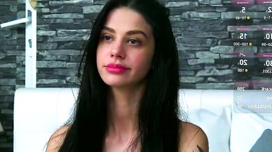 ArinaRhodes, the black-haired cam girl, strips, teases, and finger-bangs herself in hot striptease