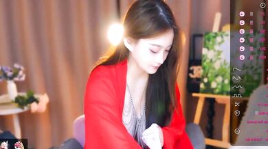 Watch ZHDHDBDKX tease and finger her young Asian pussy in a topless cam show