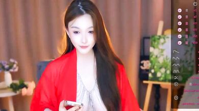 Watch ZHDHDBDKX tease and finger her young Asian pussy in a topless cam show