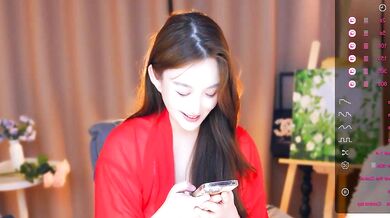 Watch ZHDHDBDKX tease and finger her young Asian pussy in a topless cam show