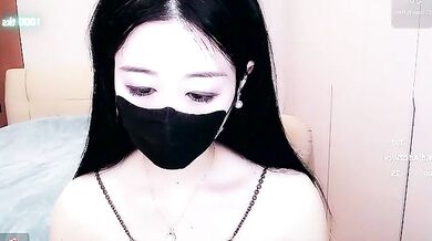 Watch petite Asian cam girl CN-xiaofei deepthroat a massive cock and get her face splattered with cum