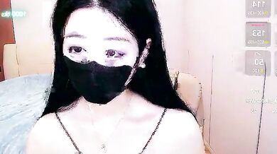 Watch petite Asian cam girl CN-xiaofei deepthroat a massive cock and get her face splattered with cum