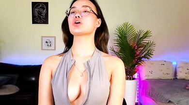 Petite Asian cam girl VinaSky gets oiled up & spanked in POV foot fetish video