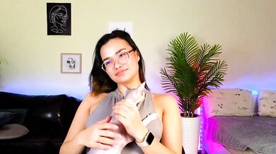 Petite Asian cam girl VinaSky gets oiled up & spanked in POV foot fetish video