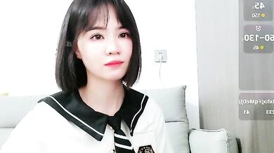 Watch as this hot Asian cam girl gives a kinky footjob and gets a messy creampie from her mistresses